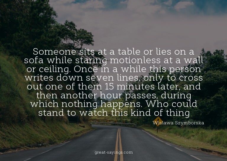 Someone sits at a table or lies on a sofa while staring